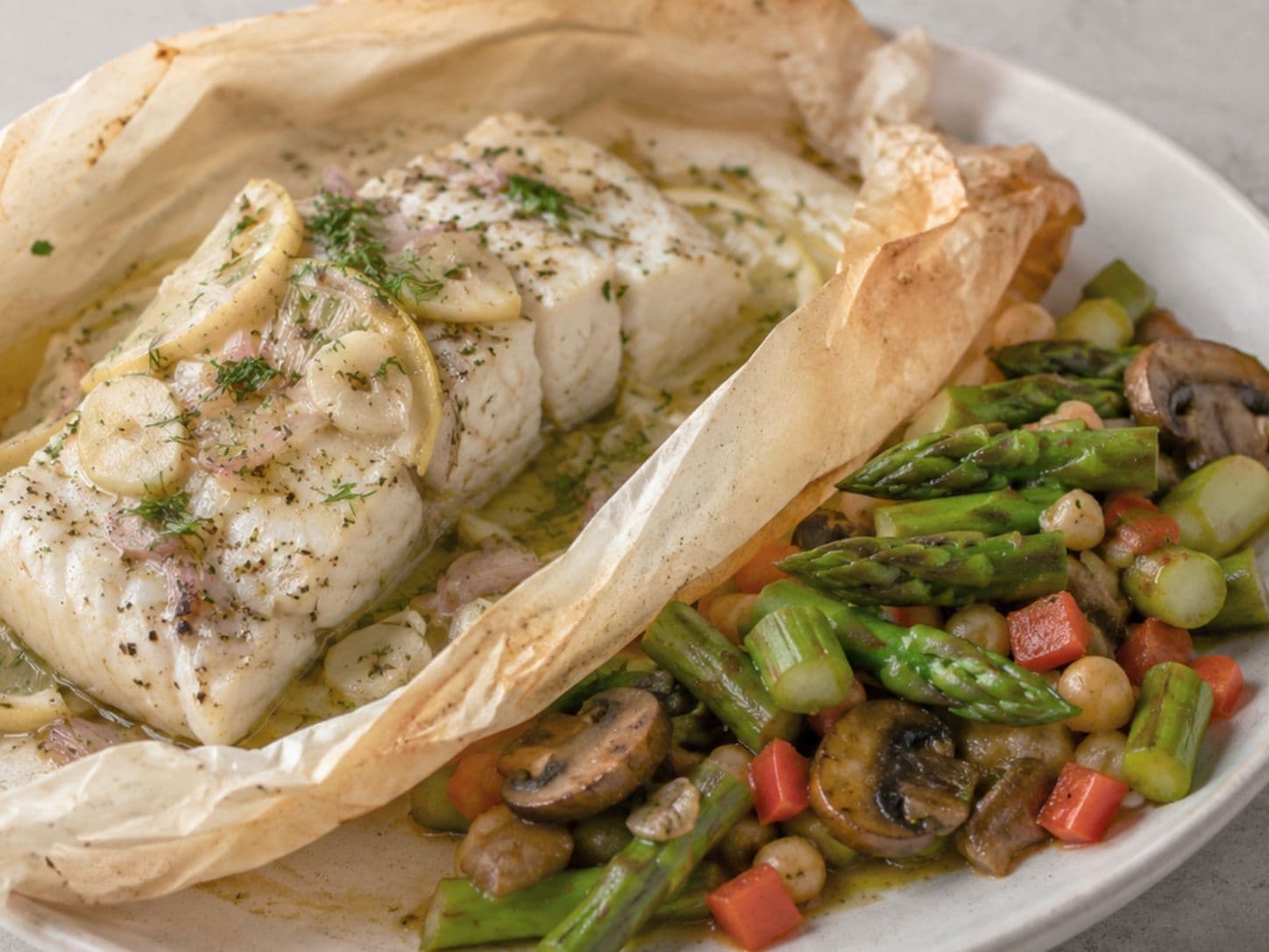 Mediterranean Baked Cod in Parchment with Asparagus Mushroom Succotash
