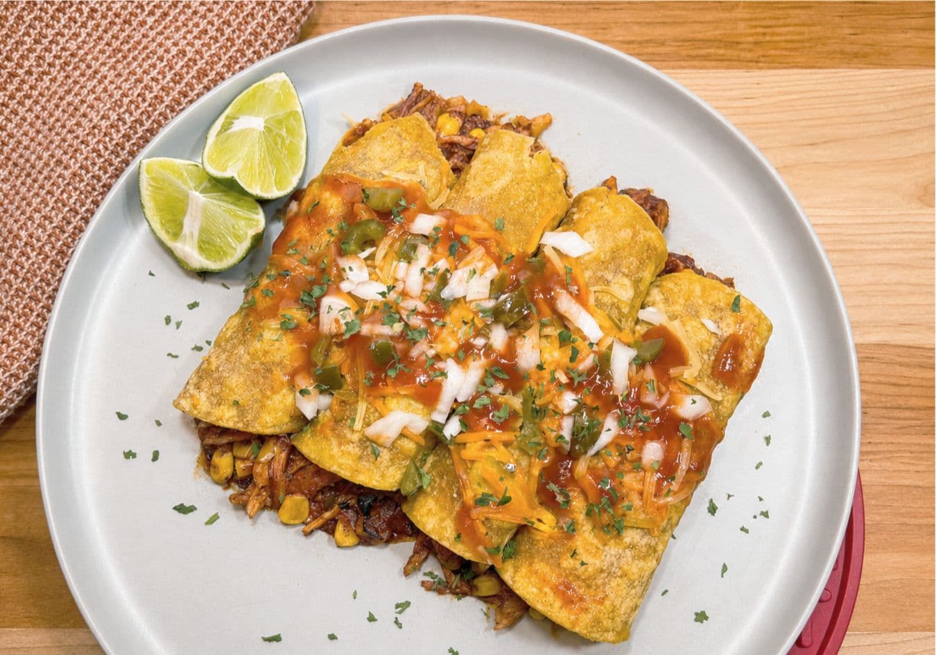 Smoky Adobo Chicken Enchiladas with Corn, Jalapeño & Sour Cream