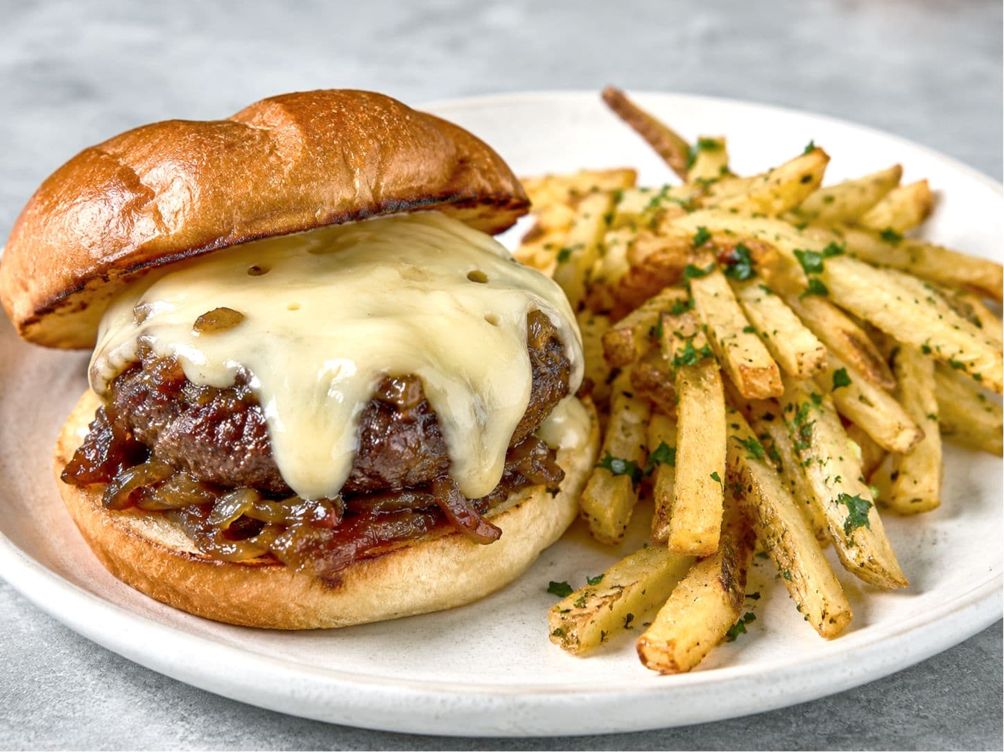 Fondue-Style Swiss Burger with Caramelized Onion Jam & Parsley Fries