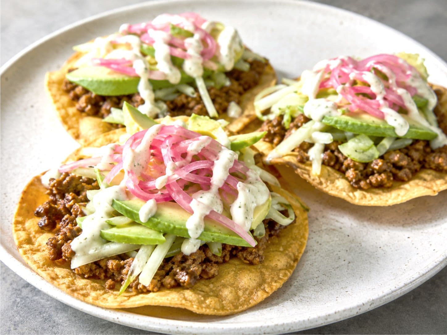 Crispy Turkey & Avocado Tostadas with Pickled Onion, Chayote & Crema